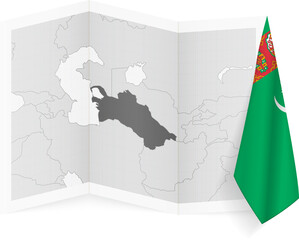 Turkmenistan grayscale map and hanging flag.