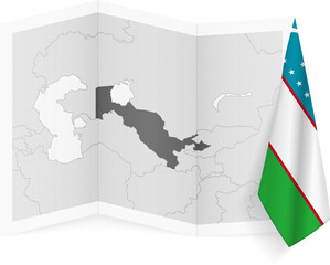 Uzbekistan grayscale map and hanging flag.