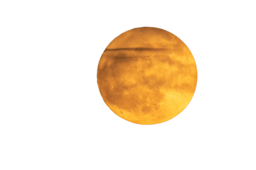 Super moon in orange color. Full moon in orange tones. some clouds are in front of the moon