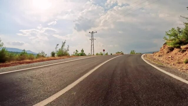 Road trip by car along the mountain roads and serpentines on sanset of Turkey.
