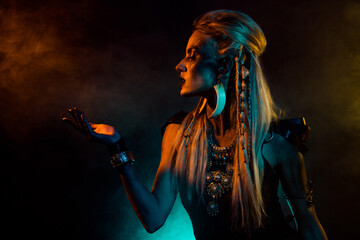 Profile photo of dangerous north mythology valkyrie lady hand hold yellow light fog isolated on...