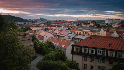 Fototapeta na wymiar View of Prague Castle from the summer Vyšehrad at sunset. Amazing view of the city rooftops.