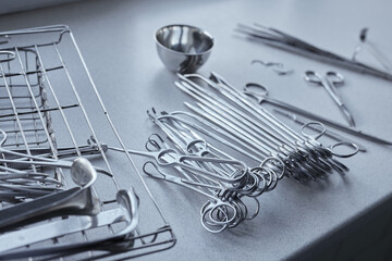 Surgical medical instruments close up in disinfection cabinet, selective focus
