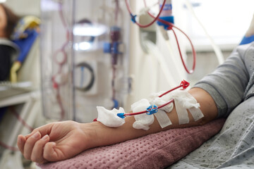 donor's hand in blood transfusion clinic, donation concept, selective focus