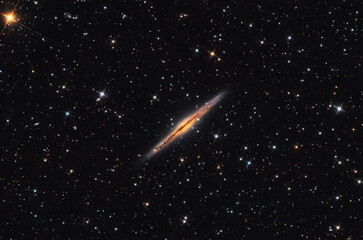 NGC 891 galaxy in the Andromeda constellation, taken with telescope.