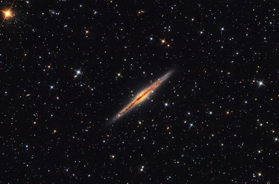 NGC 891 galaxy in the Andromeda constellation, taken with telescope.