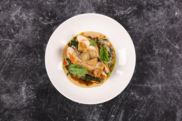 Chicken fillet with spinach and sun-dried tomatoes in coconut milk.