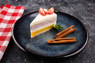 cheesecake cake with strawberries on a dark background.