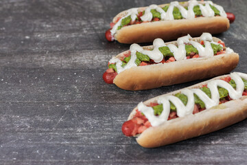 complete italian: on table, tomato, mayonnaise, vianesa, palta on hot dog bun. Space for left copy. Typical Chilean food concept