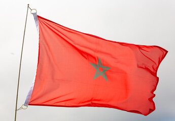 National red flag of Morocco with green pentagram in centre symbolizing Islamic heritage and...