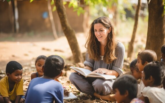 A volunteer teaching underprivileged children