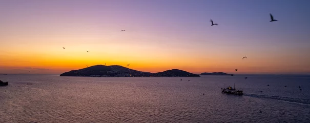 Fotobehang Aerial view of Prince Islands in Istanbul at sunset. Istanbul, Turkey. Ferry goes to the island at sunset. Drone shot. © resul