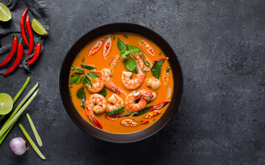 A Soup with shrimps. View from the above on gray background