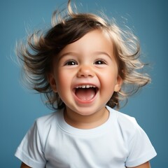 Portrait of happy little girl with curly hair and cheeerful smile isolated on blue background