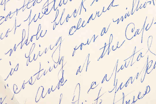 Closeup of a handwritten letter in cursive background