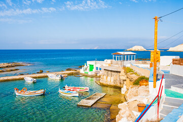 Colorful fishing boats on azure sea water in Mandrakia port, Cyclades, Milos island, Greece
