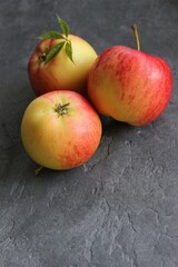 dark background with juicy red-yellow apples. Nature abstract background. ripe apples, beautiful background texture, vitamins