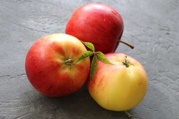dark background with juicy red-yellow apples. Nature abstract background. ripe apples, beautiful background texture, vitamins