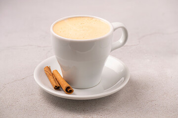 Latte cup isolated on gray background. White cup. Brazilian coffee.