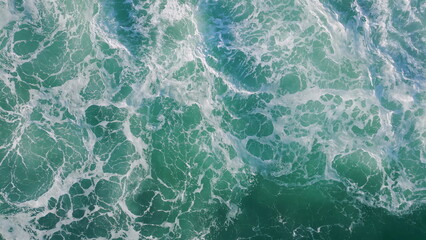 Top rough sea surface waving with foam. Aerial shot stormy ocean waves rippling.
