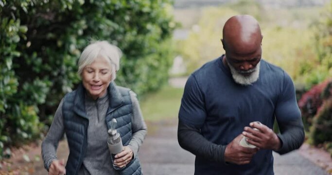 Old people, fitness and drinking water, running outdoor with interracial couple and cardio, health and hydration. Thirsty, wellness and black man with woman in street, start run and bottle with h2o