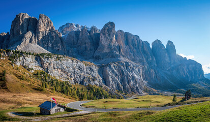 Scenic view of Gardena Pass with Sella group and Sassolungo - Langkofel mountain group (right),...