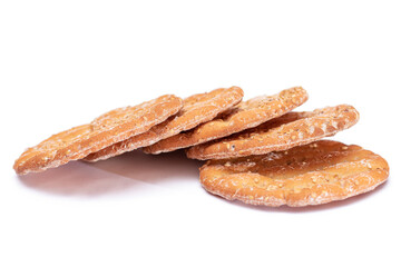 A Heap of Round Salt Crackers with Sesame Isolated on White Background. Dry Snacks - Isolation
