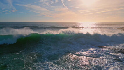 Powerful ocean surf rolling seashore sunny morning. Huge sea waves making foam