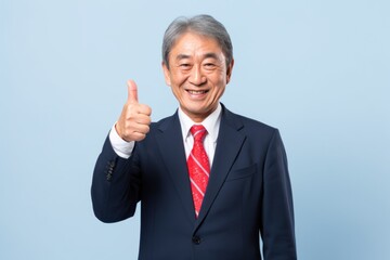 Elder Asian businessman thumb up smile face