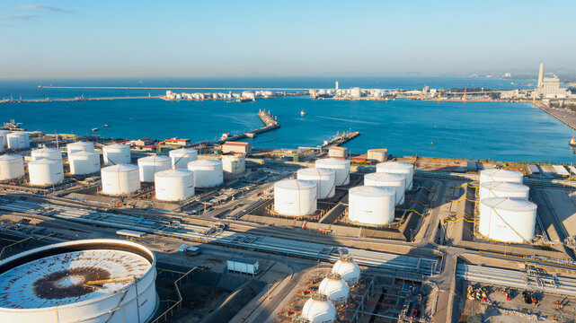 Aerial view or oil terminal is industrial facility for storage tank of oil and lpg Petrochemical. oil manufacturing products ready for transport and business transportation, lpg tank, cng tank