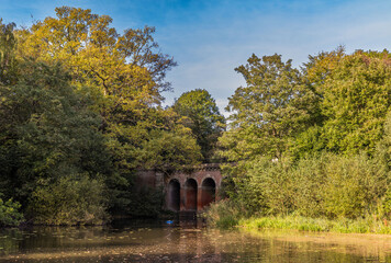 Iconic Viaduct Pond in Hampstead  Heath. The bridge was built between 1844 and 1847 by Sir Thomas Maryon Wilson. - obrazy, fototapety, plakaty