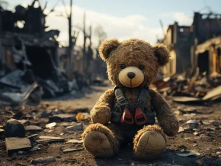 Fototapeten brown teddy bear on road in city war situation building destroy by missile in bird eyes view © zanderdesk