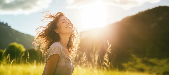 Backlit Portrait of calm happy smiling free woman with closed eyes enjoys a beautiful moment life on the fields at sunset