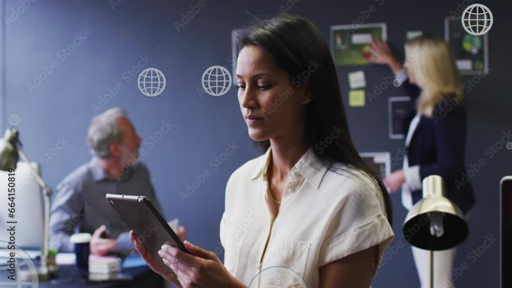 Poster animation of multiple web globe icons floating against biracial woman using digital tablet at office