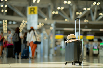 The suitcases in an empty airport hall, traveler cases in the departure airport terminal waiting...