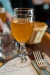 Aperitief for lunch and dinner in Limouge, France, alcoholic drink kir limousin made with champagne bubbles white wine and chestnut liqueur