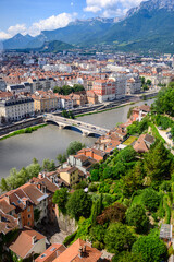 View on central part of Grenoble city from Bastille fortres witn mountains around, old cable car,...