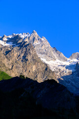 La Grave La Meije Ski off-piste resort, unique in Alps with single groomed slope on the glacier, freeride, view on peak La Meije, Massif des Ecrins, Hautes Alpes, France in summer