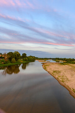 View from Pont de Pouilly-sur-Loire bridge 496 km from the source and 496 km from the mouth of the Loire river near Pouilly-sur-loire, Central France ar sunset