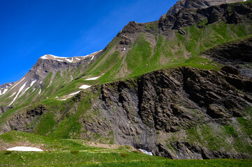 Mountains and alpine meadows views near Col du Lautaret, Massif des Ecrins, Hautes Alpes, France in summer
