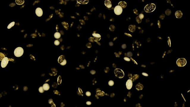 Bitcoins falling against a black background
