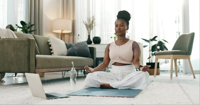 Meditation, exercise and a black woman on the floor in the morning for mindfulness. Fitness, home and an African girl with a laptop for pilates, training or streaming a spiritual online video