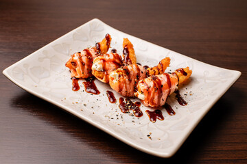 Photo of sushi dish and preparation of sushi for consumption and menu