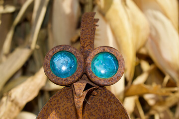 close up of a rusty bird yard ornament