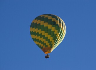 yellow and green hot air balloon in the sky