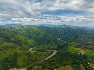 Aerial view of mountain with canyon surrounded by green forest in Mindanao. Philippines.