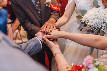 bride and groom holding hands
