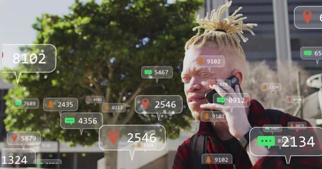 Animation of social media data processing over albino man using smartphone in city - Powered by Adobe