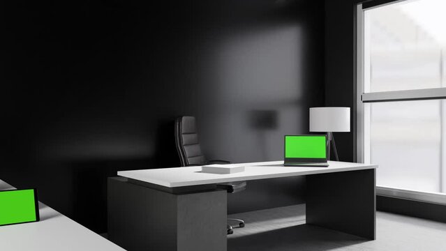 office room with laptop and tablet with green screen background