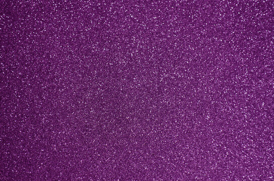 Fototapeta Fondo de brillos / textura glitter de color fucsia/rosa/violeta/morado. Se puede usar como fondo de año nuevo o navidad/ fiesta.